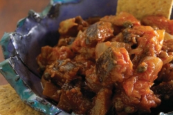 Caponata in an ornate blue bowl